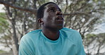 Sweating, tired and black man in woods, fitness for health benefits and rest for training. Nature, person and hiker in forest, burnout and endurance with fatigue, exhausted and breathing with break