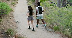 Fitness, running and couple in woods for exercise, body wellness and cardio endurance with top view. Woman, man and jog for workout in forest, health and training with interracial people for sports