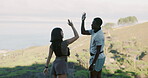 Fitness, high five and watch with couple outdoor in nature together for celebration or success. Exercise, motivation and time with happy hiker people in mountains for adventure, bonding or support