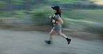 Fitness, running and woman in nature with motion blur for cardio health, wellness and fast. Speed, runner and person in forest for workout, exercise and training with energy for sports outdoor