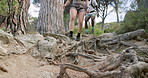 Couple, legs and exercise on mountain with trail running, endurance training or sport for wellness. Active, people shoes and jog outdoor in nature with fitness, cardio workout or healthy relationship