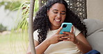 Phone, laugh and woman on hanging chair outdoor with texting, social media or chatting on mobile app. Technology, communication and female person with cellphone for online contact in backyard of home