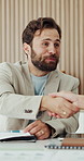 Proposal, man and handshake in office for writer, news reporting and project update. Publishing agency, journalist and paperwork for creative article, shaking hands and internship in newsroom