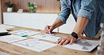 Businessman, hands and writing with sticky note or documents for analytics or statistics in office. Man, employee or analyst taking notes on papers, graph or chart for performance review in workplace