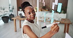 Glass wall, planning and black woman in office with research, ideas or information for creative project. Board, writing and magazine editor thinking for article with publishing in startup agency.