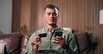 Phone, credit card and confused man in home with payment fail, scam or banking error. Mobile, debit and person on sofa with online shopping glitch, low balance or checkout problem for financial fraud