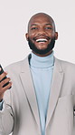 Excited, face and businessman with smartphone in studio, good news and celebration for lotto success. Happy, black person and employee with mobile for competition, white background and win in Nigeria