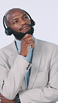 Black man, thinking or consultant with headset in studio for enquiry on a white background. Thoughtful, businessman or agent with mic or contemplation for customer service, business idea or solution