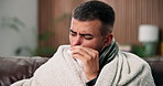 Sick man, flu and blowing nose with tissue in home for influenza, virus or infection on sofa. Male person, cold or blanket with toilet paper, bacteria or germs for allergy, hayfever or sinus in house