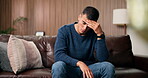 Home, sad and man with stress, thinking and regret for break up, lonely or frustrated in living room. Serious, reflection and person with depression for toxic relationship, anxiety and grief on couch