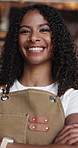 Happy woman, face and small business with confidence in cafe for management or startup. Portrait, female person or waitress with smile or arms crossed in restaurant for career or job in coffee shop
