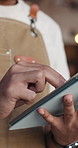 Person, hands and inventory with tablet in cafe for stock control, online order or schedule. Closeup, waiter or scrolling with technology for small business management or startup in coffee shop