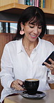 Happy woman, customer and drinking with phone in coffee shop for latte, cappuccino or beverage. Female person, relax and caffeine with mobile smartphone in restaurant or indoor cafe for espresso