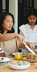Lunch, chicken and serve with woman and family outdoor for bonding, eating and connection. Holiday celebration, healthy food and love with people in backyard of home for care and dining table