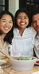 Lunch, happy and hug with face of family outdoor for bonding, eating and connection. Holiday celebration, healthy food and love with people in backyard of home for care, smile and dining table