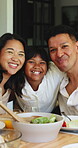 Lunch, smile and hug with face of family outdoor for bonding, eating and connection. Holiday celebration, healthy food and love with people in backyard of home for care, happy and dining table