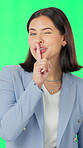 Secrets, face and woman on green screen with wink, mystery news or whisper in surprise announcement. Silent, gossip or person in studio with hand gesture, confidential or shush emoji in disclosure.