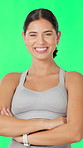 Arms crossed, face and fitness with woman on green screen for health, satisfaction or wellness. Confidence, exercise benefits and smile of happy person in studio for training or workout results