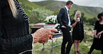 Funeral, text and hands outdoor with phone, family arrangements or update on reception details. Typing, bokeh and person outside with tech, ceremony schedule or online chat at memorial service.