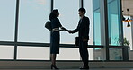 Business, folder or people in agency with handshake, greeting or meeting for b2b deal. Networking, introduction or employees in workplace with file, agreement or opportunity for partnership.