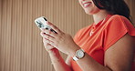 Phone, hands and businesswoman in office with chatting, social media or texting on mobile app. Technology, smile and female person with cellphone for typing email, communication or contact at agency.