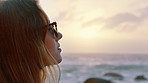 Sunset, thinking and woman with mindfulness at beach, remember memory and reflection for holiday peace. Sea, summer break or calm person with fresh air for vacation mindset, daydream or perspective