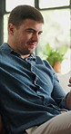 Smile, man and relax with phone at house for browsing website, reading blog and morning news. Male person, rest and mobile on couch for streaming movies, social media and notification of text message
