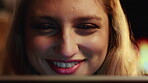 Night, woman and smile in home with laptop, watch movie and online entertainment on weekend break. Evening, female person and happy in house with computer, relax or streaming service for reality show