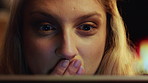 Night, woman and watching movie in home with laptop, surprise and drama for reality show on weekend. Evening, female person and shock in house with computer, online and streaming service for series.