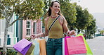Happy, woman and shopping with bags in city for travel, retail purchase and customer experience. Smile, female person and walking outdoor with package for bargain, commercial spree and boutique sales