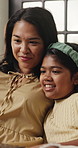 Laptop, love and relax with mom and child on sofa for streaming service, movie choice and education show. Film subscription, bonding and online kids series with woman and daughter in family home