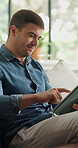 Home, copywriting and man on couch, tablet for online submission and research for manuscript. Remote work, writer and person with internet, scroll or tech for news report review and email for article