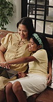 Laptop, love and choice with mother and girl on sofa for streaming service, movie choice and education show. Film subscription, bonding and online kids series with woman and daughter in family home
