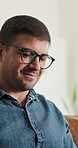 Remote work, review or man in house with glasses, draft edit or source feedback for article. WFH, specs or journalist on couch with tech, blog fact check or industry research for publication.