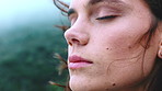 Wind, breathe and woman outdoor with thinking on holiday, weekend trip or getaway with relax. Memory, calm and person with breeze in hair for break, vacation or travel in nature with mindfulness.