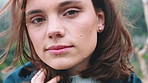 Wind, calm and face of woman outdoor with thinking on holiday, weekend trip or getaway with relax. Portrait, ideas and person with breeze in hair for vacation or travel in nature with mindfulness.