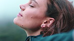 Woman, relax and fresh air in nature with wind, mindfulness and thinking for inspiration on weekend. Happy person, breathing and tranquility outdoor with breeze, zen reflection or peace for wellness.