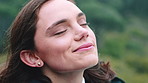 Woman, relax and fresh air in nature with smile, mindfulness or thinking for inspiration on vacation. Happy person, breathing and tranquility outdoor with memory, zen reflection or peace for holiday.