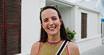 Face, smile and woman in city for travel, tourism and urban adventure with wanderlust on holiday. Portrait, vacation and happy person in town outdoor for getaway, commute and summer trip in Germany