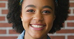 Education, face and smile of student black girl on brick wall background for learning or study. Development, knowledge and scholarship with happy African person on college or university campus