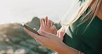 Hands, phone and texting at beach on vacation with scroll, chat or online dating in summer on rocks. Woman, smartphone and click with mobile app, contact and social media on seaside holiday by ocean