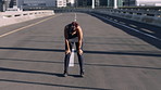 Runner, tired and woman in street, fitness and burnout with exercise, cardio workout and practice. Outdoor, person and athlete in city, training for health benefits and breathing with break or rest