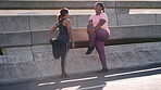 Fitness, stretching and woman friends on bridge in city together for start of cardio training. Exercise, getting ready and wam up with runner people outdoor for commitment, dedication or workout