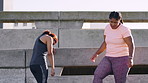 Fitness, friends and women in city for exercise, talking and fatigue on break and wellness on bridge. Runner, people and workout for body goals on road, exhaustion and training for health or outdoor