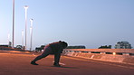 Fitness, night and stretching with woman on bridge in city for commitment or dedication to cardio. Exercise, getting ready and warm up with runner outdoor on asphalt highway for start of training