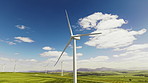 Wind turbine, renewable power or grass field with clean energy for economic development in nature. Windmill, movement or motion with eco friendly environment for alternative resource in countryside