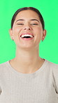 Face, laughing and reaction with woman on green screen for comedy, humor or positive expression. Excited, friendly and funny with happy person isolated in studio for cheerful character or personality