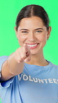 Volunteer, green screen and face with woman, pointing or accountability on studio background. Happiness, charity work recruitment or person with gesture for social responsibility, pride or ngo choice