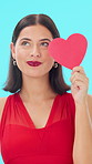 Paper, heart or face of woman in studio with smile, valentines day celebration or thinking of anniversary. Romantic idea, emoji or happy person with laugh for love symbol, portrait or blue background