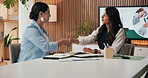 Business, women and meeting with handshake in office for hiring, partnership or annual report. Female people, employees or colleagues shaking hands with smile for company proposal, deal or agreement